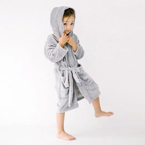 Girl wearing soft grey hooded robe
