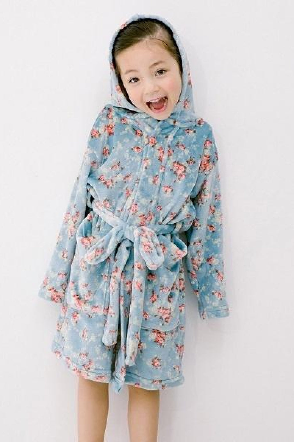 Girl wearing soft blue floral robe