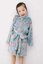 Load image into Gallery viewer, Girl wearing soft blue floral robe
